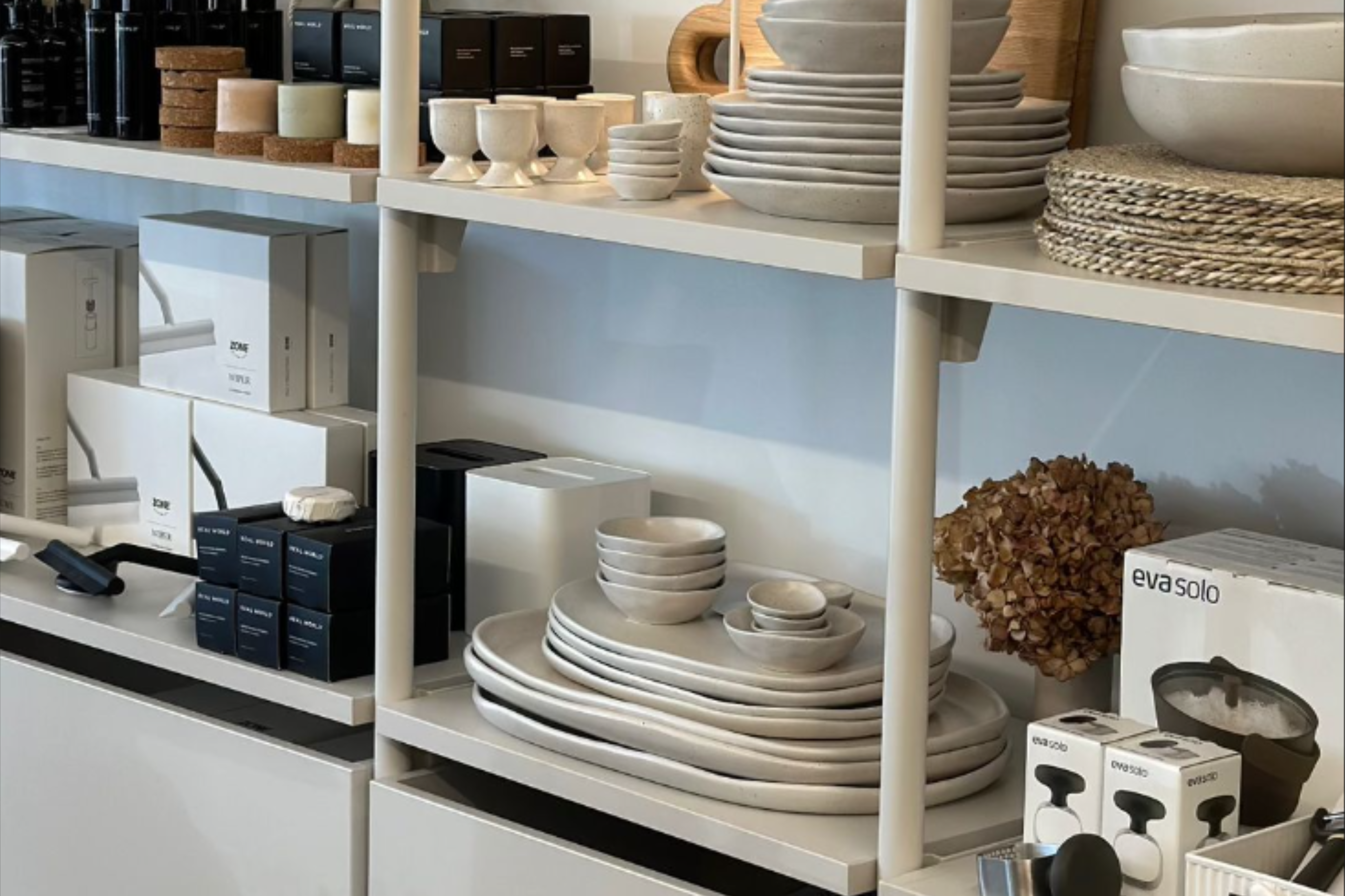 Custom modular showroom display system with cupboards for flexible retail product displays.